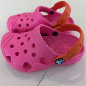 Used once! Crocs Swiftwater Clog Toddler Size 7 in Fusha/Orange
